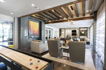 Resident game lounge with billiards, shuffleboard, and arcade games